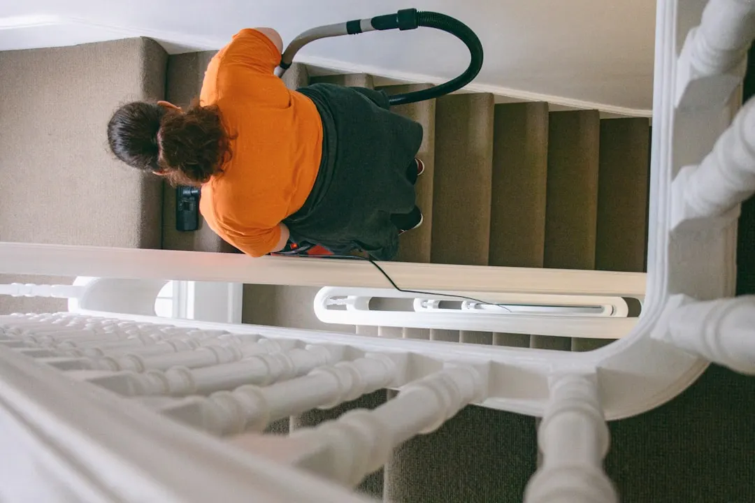Duct cleaning technician with HEPA vacuum in Houston