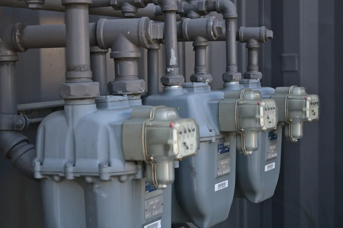 Pool heater installation with gas piping in a Houston backyard