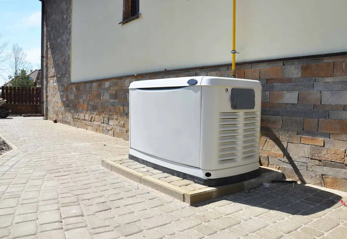 Residential standby generator on concrete pad