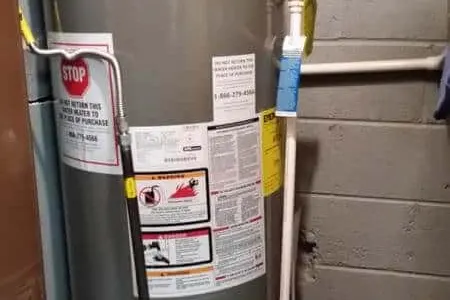 Water heater tank service in a Houston basement
