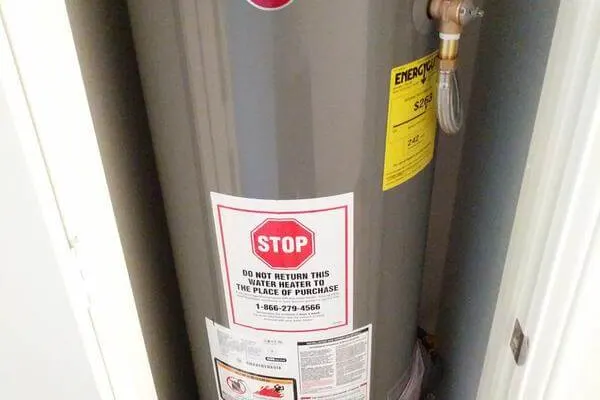 New water heater installation in a residential mechanical room
